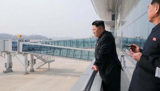 Illustration for article titled 'Look At My Fancy New Airport Terminal,' Says Noted Despot Kim Jong Un